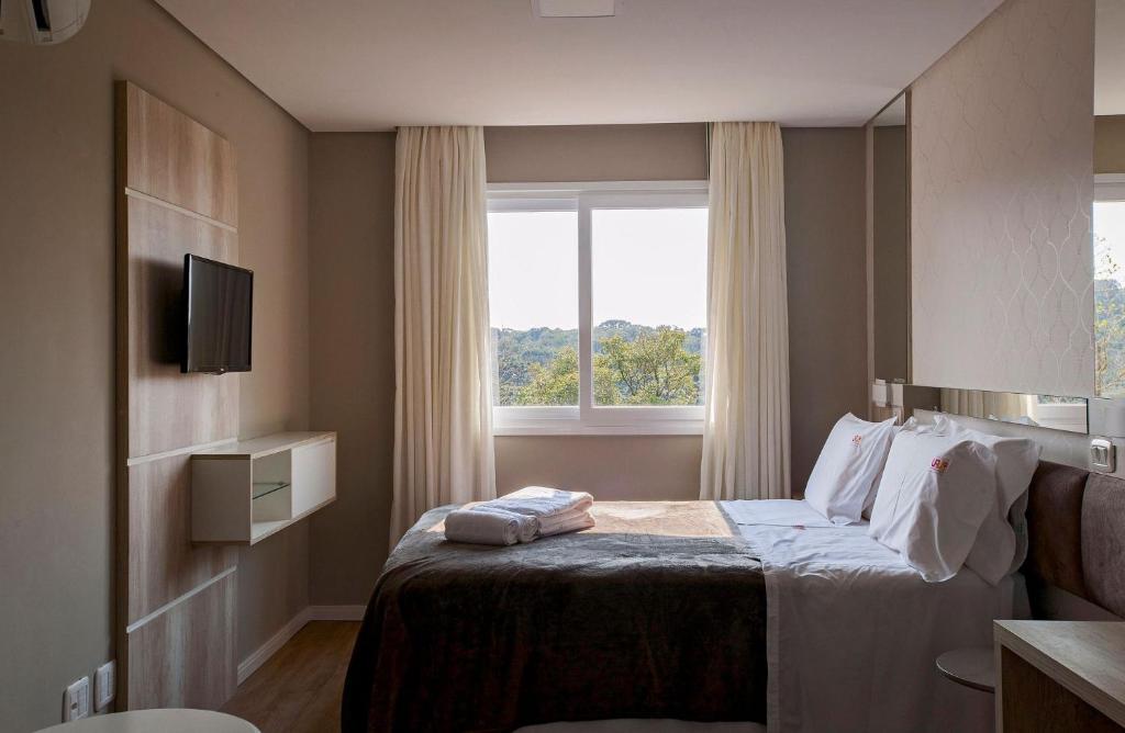 Jardins de Gramado 102 - 2 Suítes e Lavabo no Centro  Jardins de Gramado 102 - 2 Suítes e Lavabo no Centro