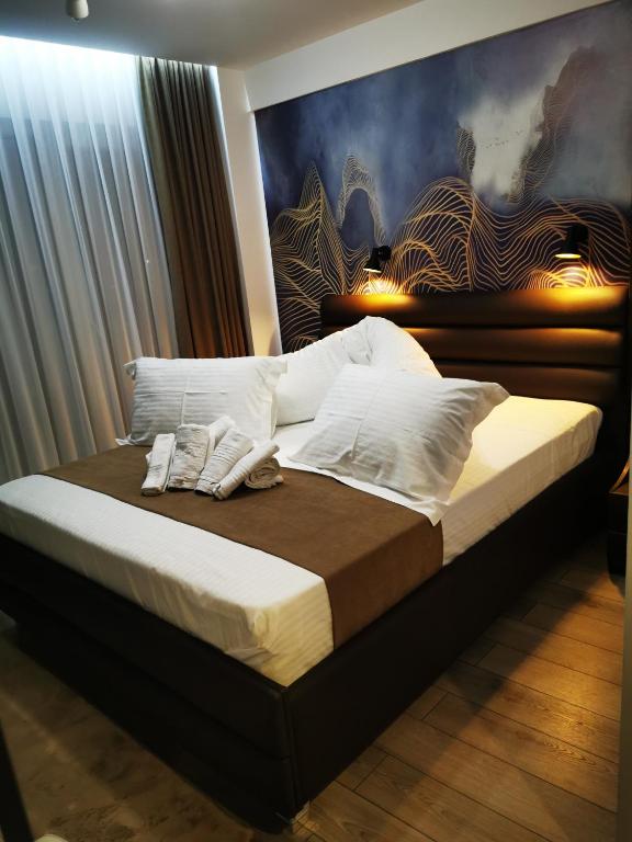 Postel nebo postele na pokoji v ubytování Doftana Apartaments