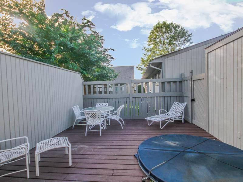 a deck with a table and chairs and a table and chairs at Sea Colony - 3701 Tie Breaker in Bethany Beach