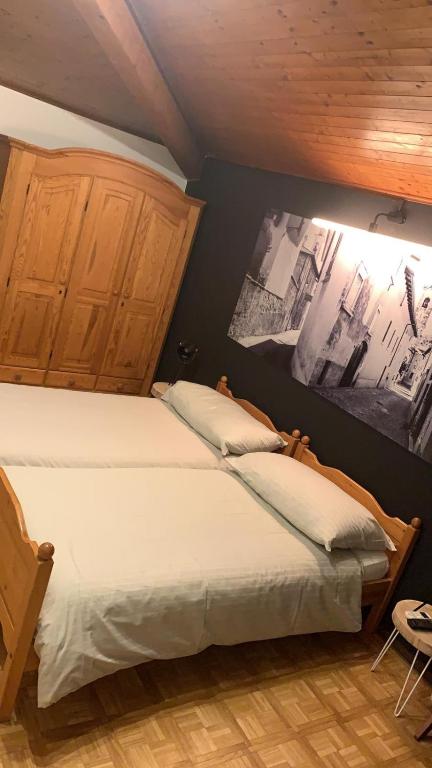 Postel nebo postele na pokoji v ubytování Borgovecchio Albergo