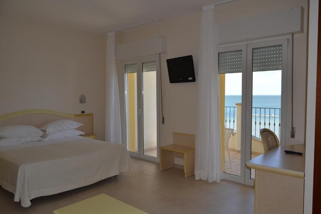 Postel nebo postele na pokoji v ubytování Hotel Zeus