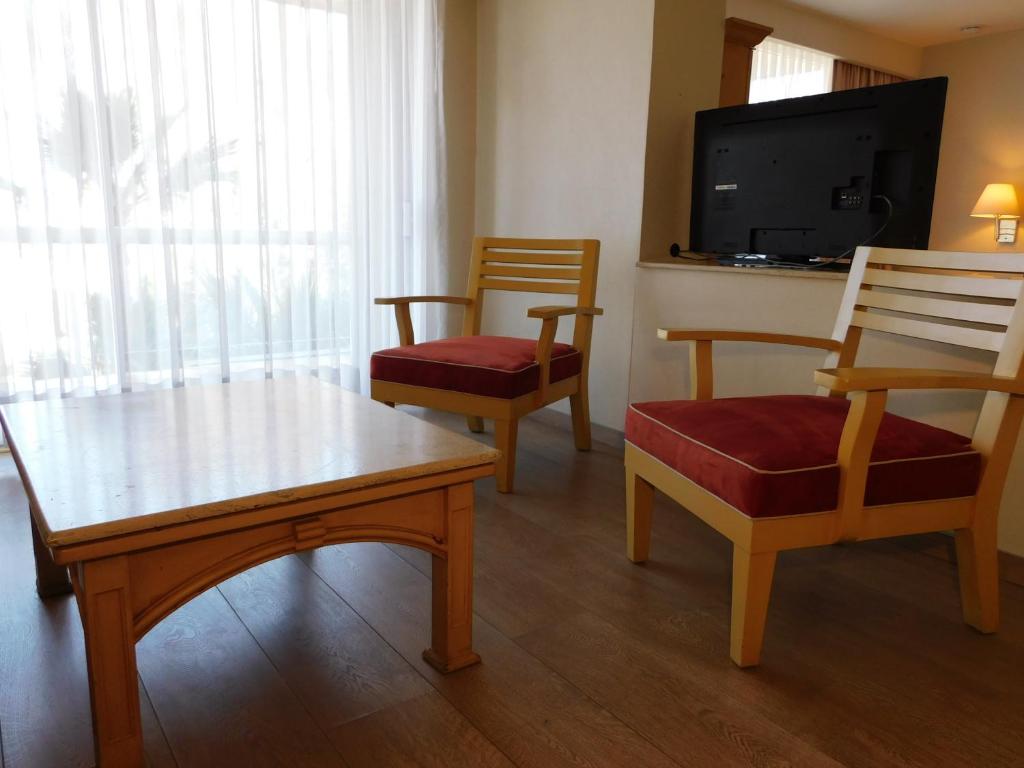 TV a/nebo společenská místnost v ubytování Hotel Palacio Azteca