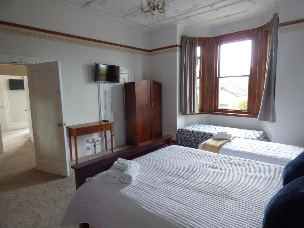 Katil atau katil-katil dalam bilik di Sahara Guest House