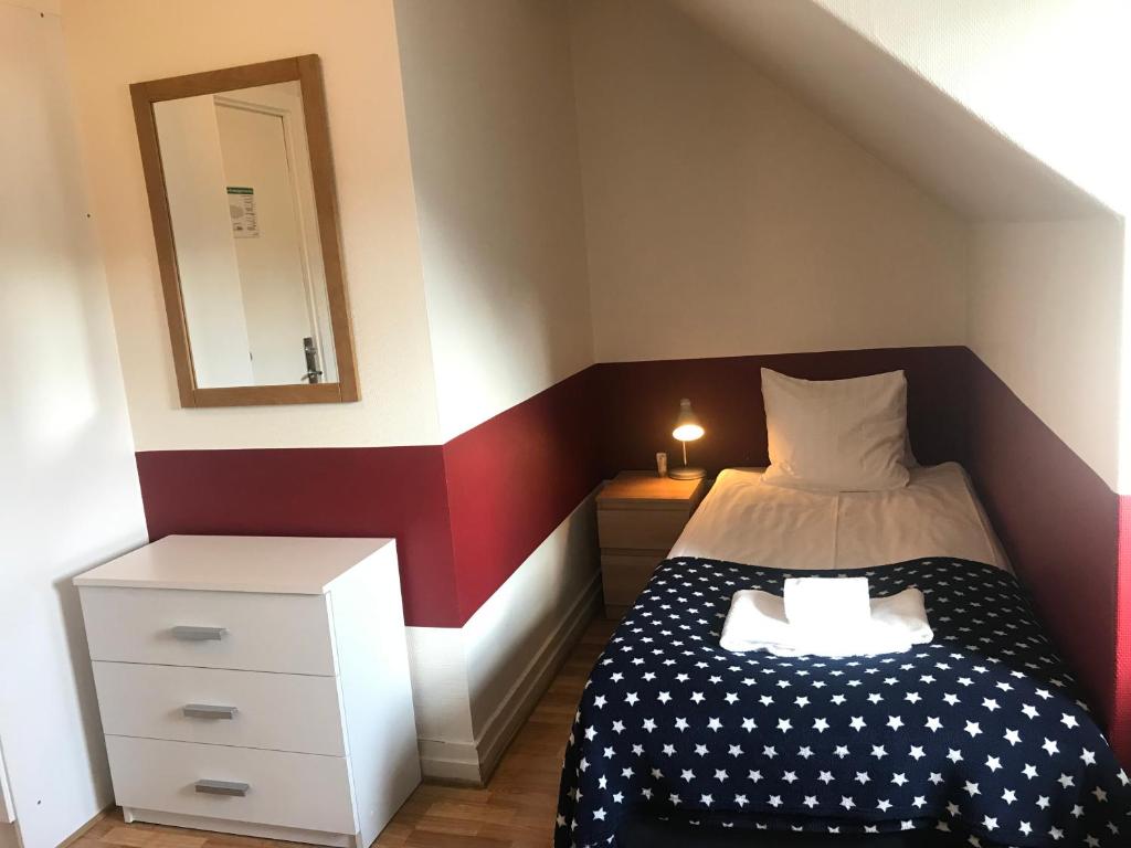 Postel nebo postele na pokoji v ubytování Port Hotel
