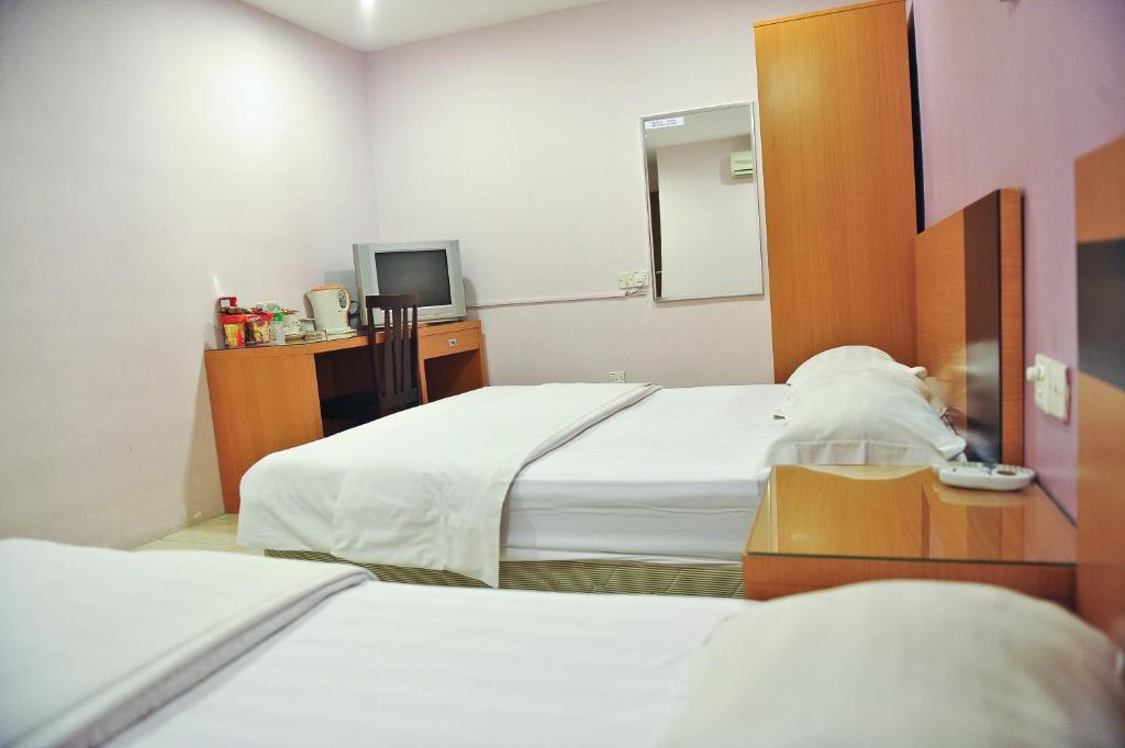 Postel nebo postele na pokoji v ubytování Hotel Centum