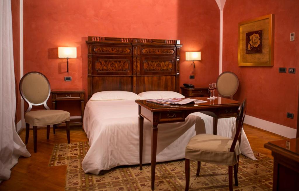 Voodi või voodid majutusasutuse Hotel Carmine toas