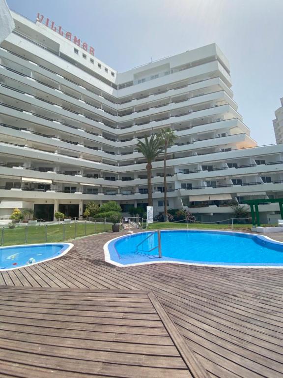 Bazén v ubytovaní Primera línea de mar ! Fantástico apartamento alebo v jeho blízkosti