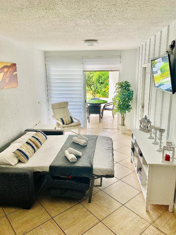 Televízia a/alebo spoločenská miestnosť v ubytovaní Primera línea de mar ! Fantástico apartamento
