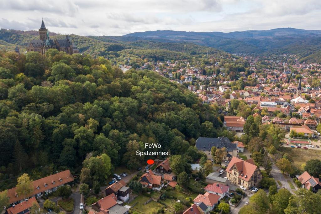 an aerial view of a town in a valley with trees at Ferienwohnung am Schloss in Wernigerode