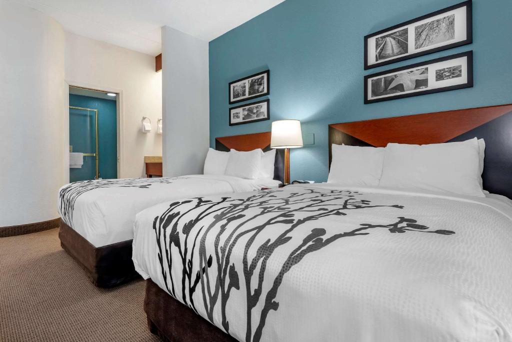 Postel nebo postele na pokoji v ubytování Sleep Inn