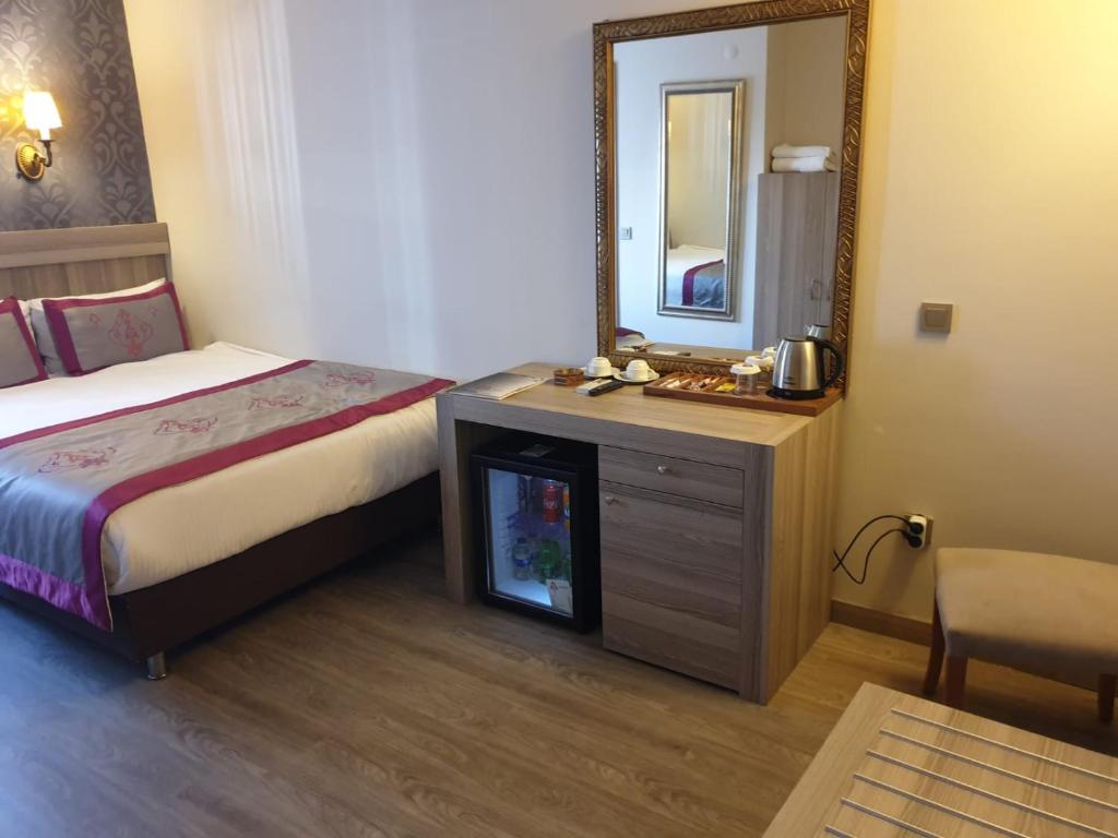 Postel nebo postele na pokoji v ubytování Dab Hotel
