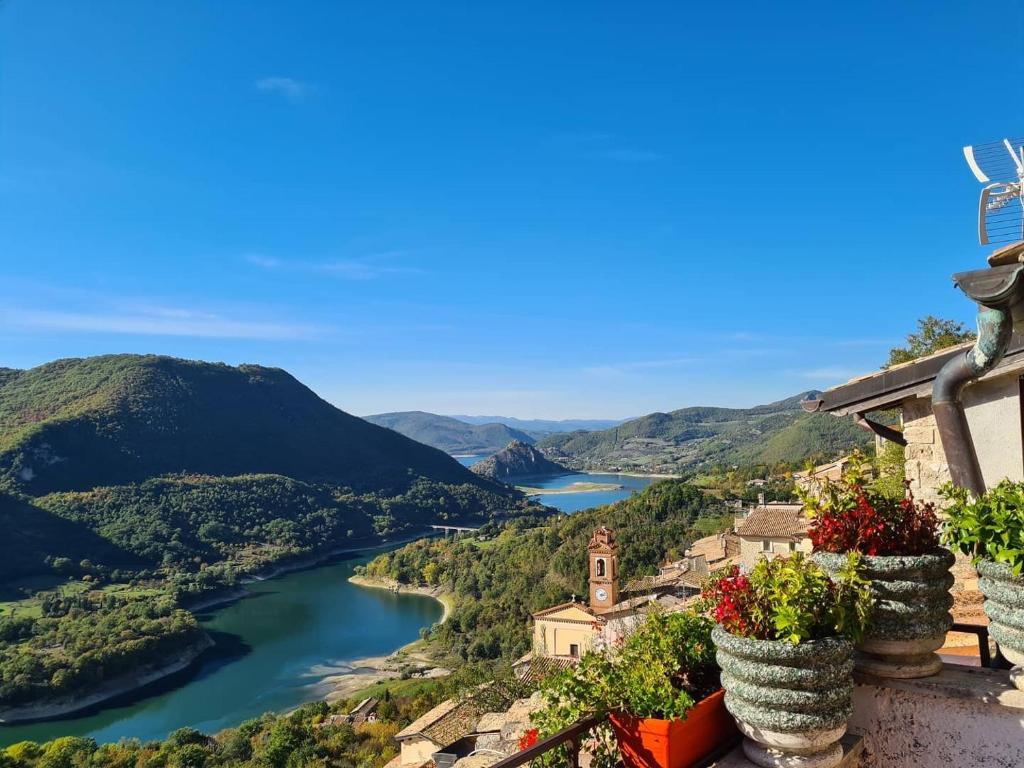 a view of a river from a house at La Casa Sul Fiordo Lago del Turano in Paganico