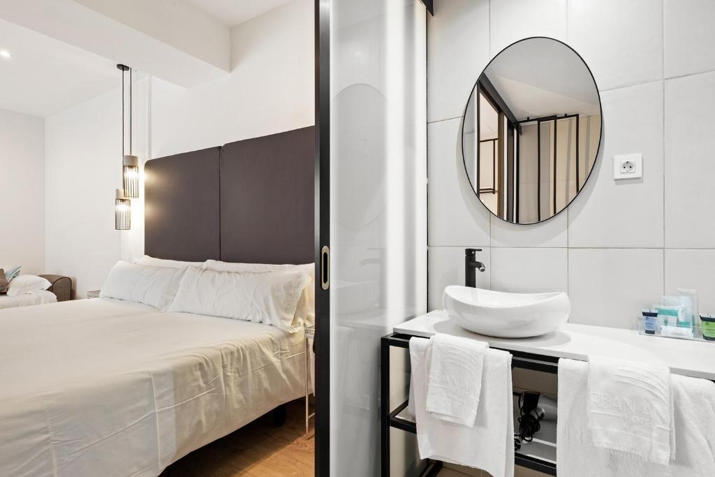 a bathroom with a bed and a mirror at Urban Anaga Hotel in Santa Cruz de Tenerife