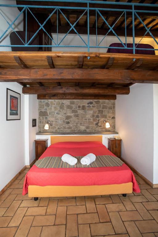 Postel nebo postele na pokoji v ubytování Residenza d'Epoca Pietra Di Ponente