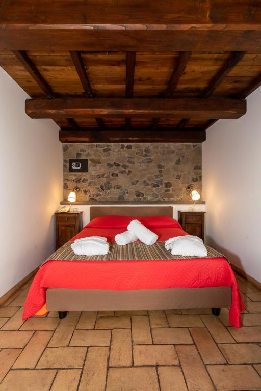 Postel nebo postele na pokoji v ubytování Residenza d'Epoca Pietra Di Ponente