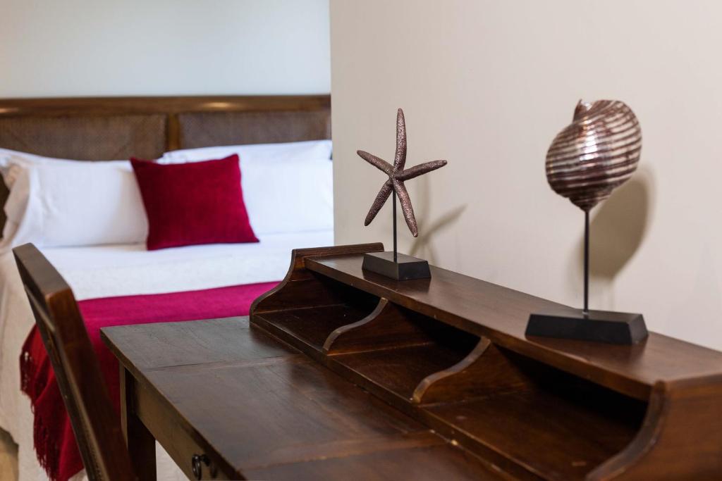 A bed or beds in a room at Hotel Arce