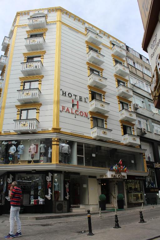 a man standing in front of a building at Hotel Falcon in Istanbul