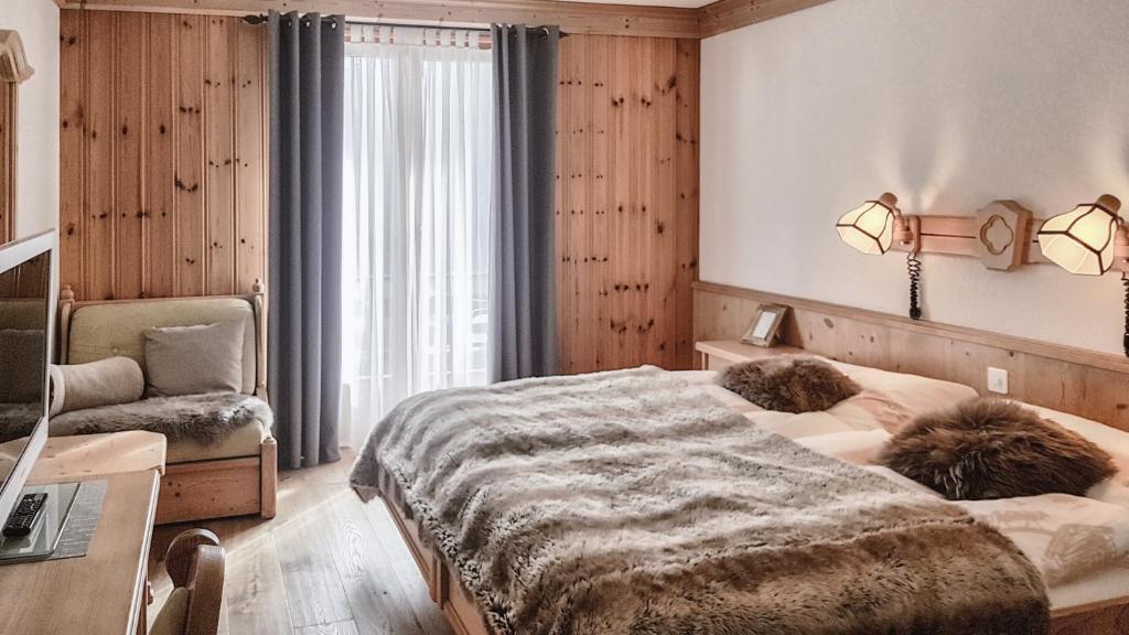 Postel nebo postele na pokoji v ubytování Hotel La Cambuse