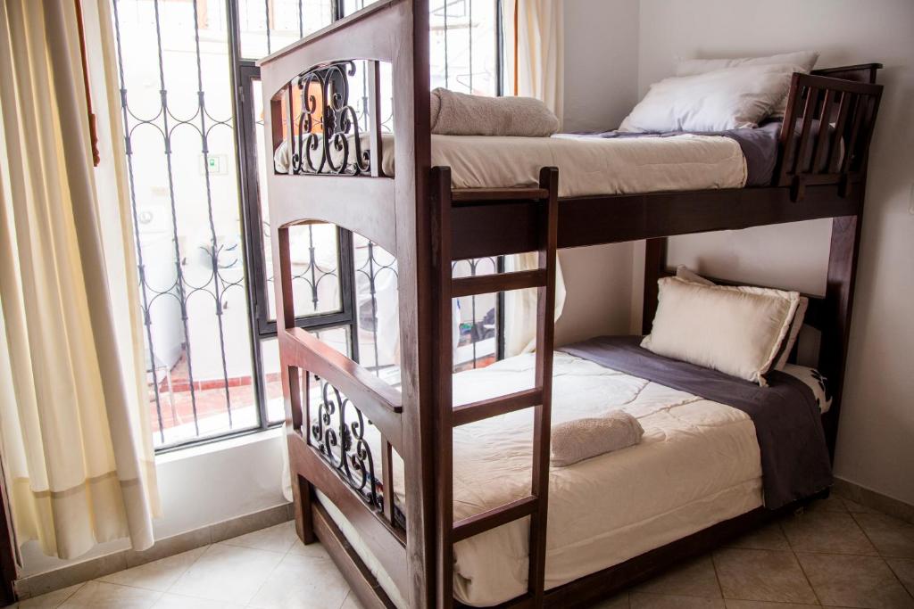 Postel nebo postele na pokoji v ubytování Family Host HOSTEL