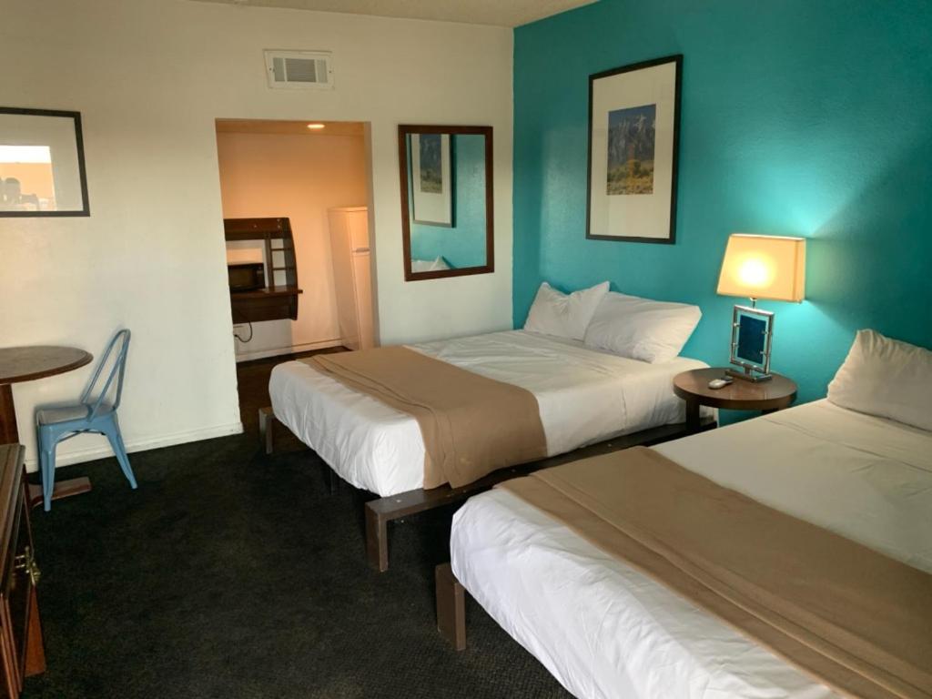 Voodi või voodid majutusasutuse Desert Hills Motel toas