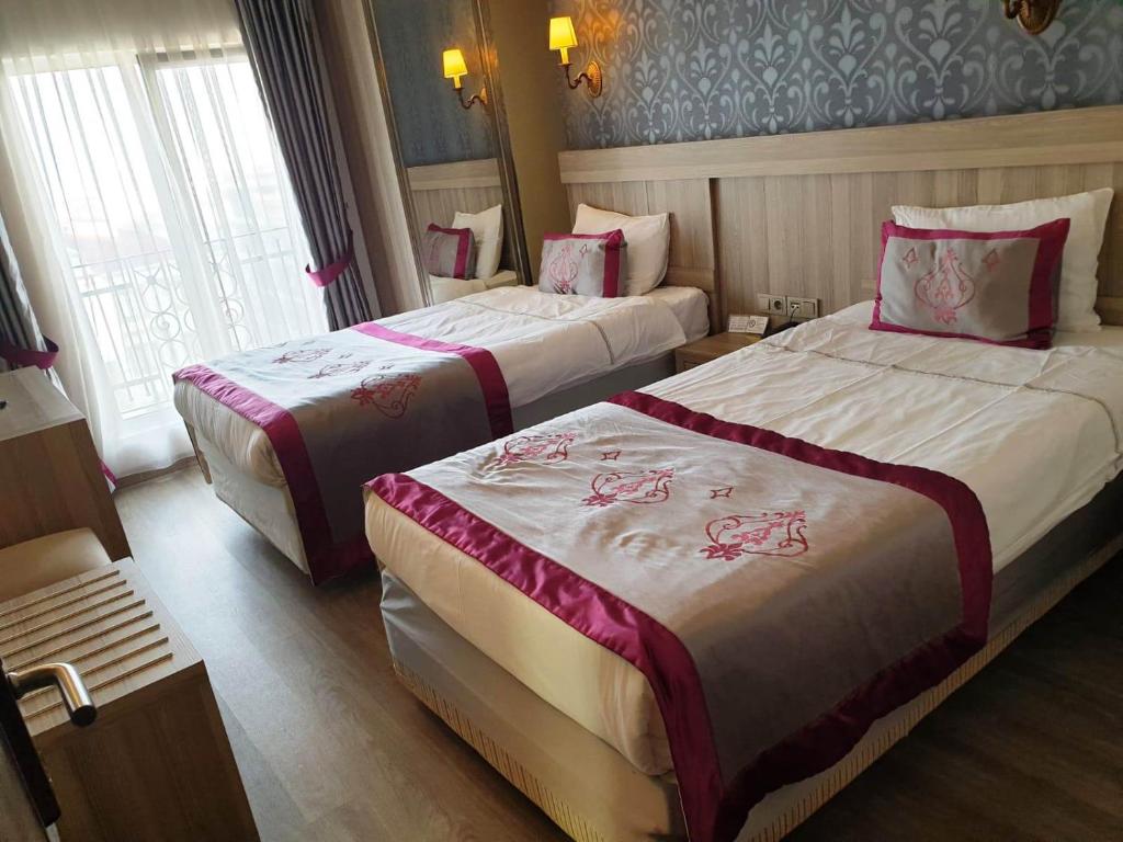 Postel nebo postele na pokoji v ubytování Dab Hotel