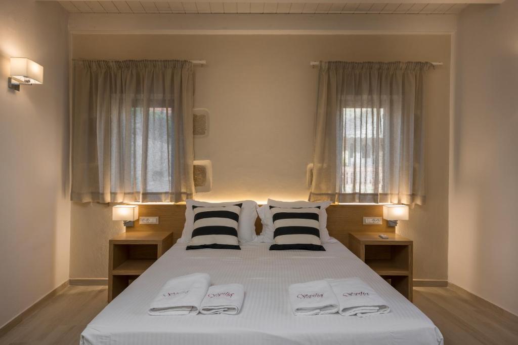 Posteľ alebo postele v izbe v ubytovaní Spilia Village Hotel & Villas