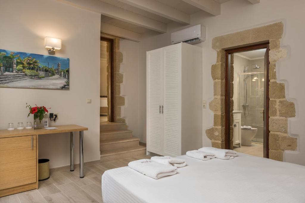 Posteľ alebo postele v izbe v ubytovaní Spilia Village Hotel & Villas