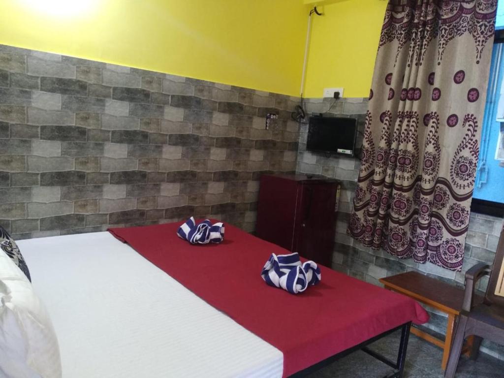 Postel nebo postele na pokoji v ubytování Baga F Leisure Stay Guest House