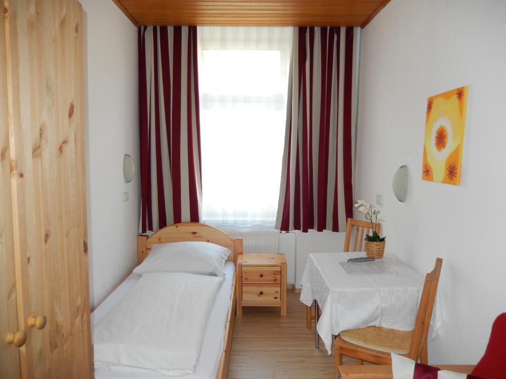 Giường trong phòng chung tại Hotel "Wilder Mann"