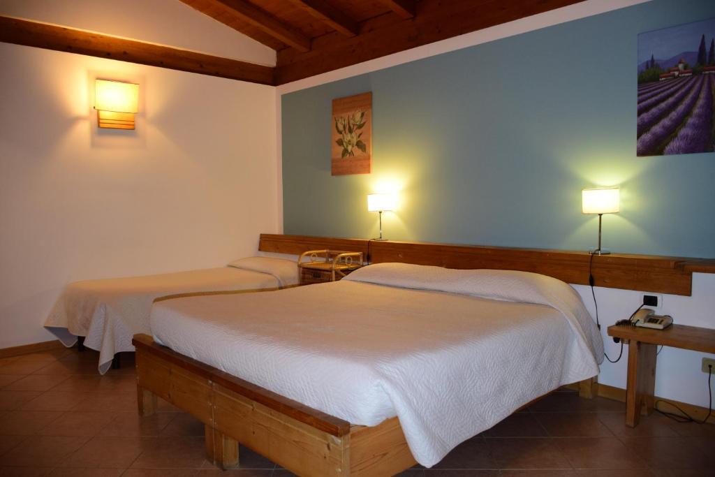 Postel nebo postele na pokoji v ubytování Park Hotel Elefante