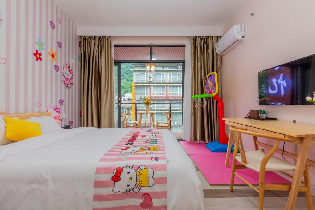 Postel nebo postele na pokoji v ubytování Yangshuo Yi Landscape Hotel