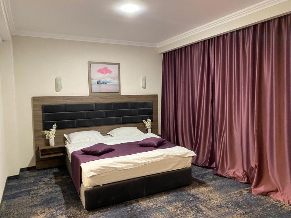 Postel nebo postele na pokoji v ubytování Hotel Yarus Plus