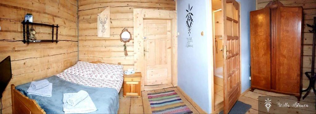 Postel nebo postele na pokoji v ubytování Willa Blanca Zakopane