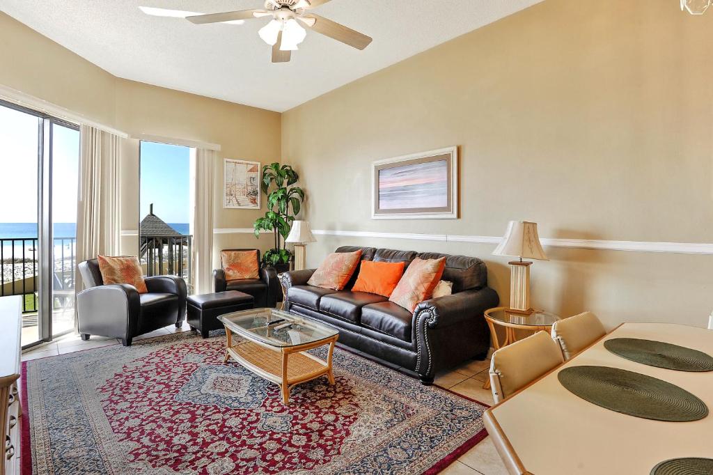 a living room with a couch and a table at Phoenix 5 Unit 116 in Orange Beach