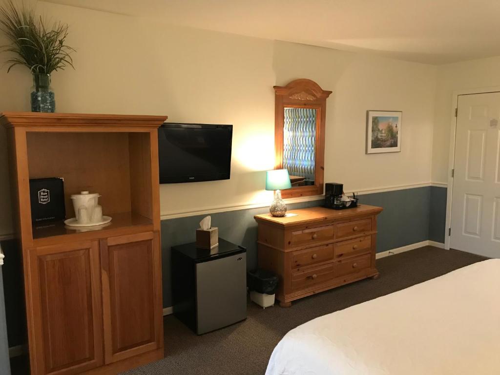 Postel nebo postele na pokoji v ubytování Main Street Motel