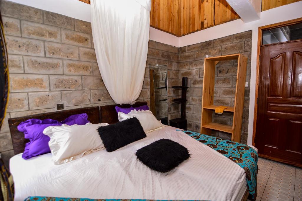 Postel nebo postele na pokoji v ubytování Runda Lofts