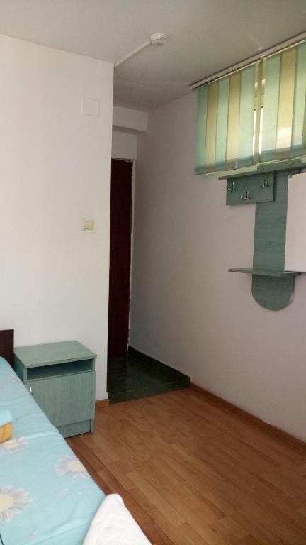 Postel nebo postele na pokoji v ubytování La Conu Iancu
