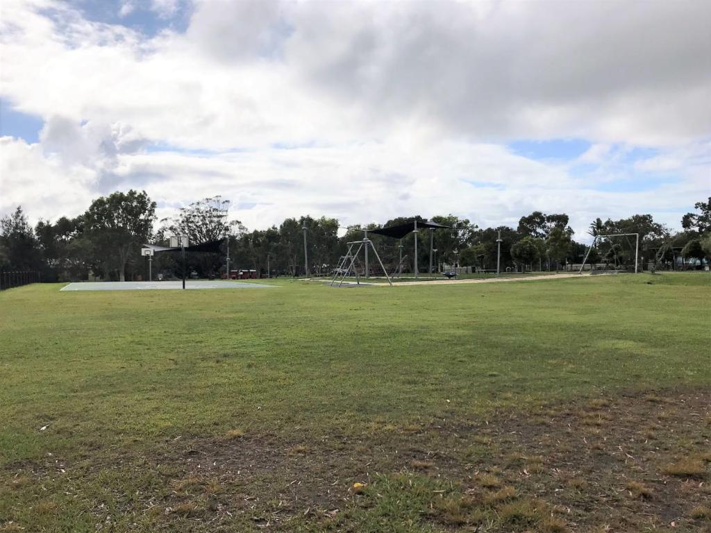 a large field with a park with a playground at Croydon Ave 50 Currimundi in Kawana Waters