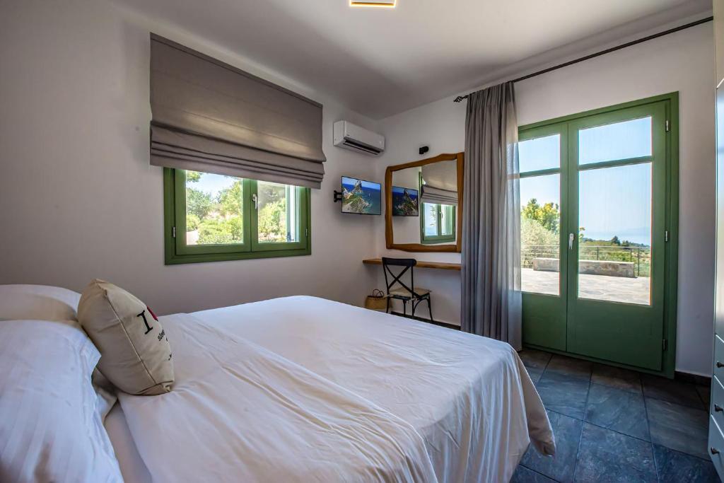 Postel nebo postele na pokoji v ubytování Stargaze Villas