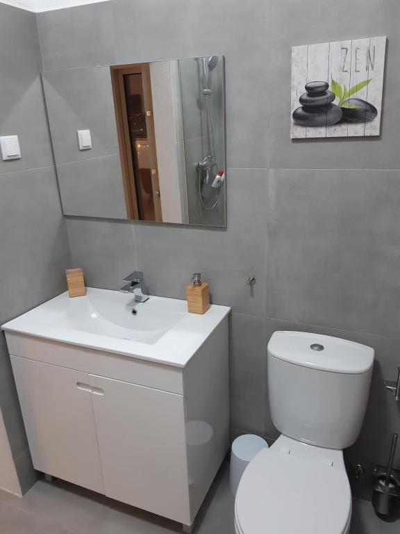 Um banheiro em CasaDuarte "NAU Deluxe Studio"