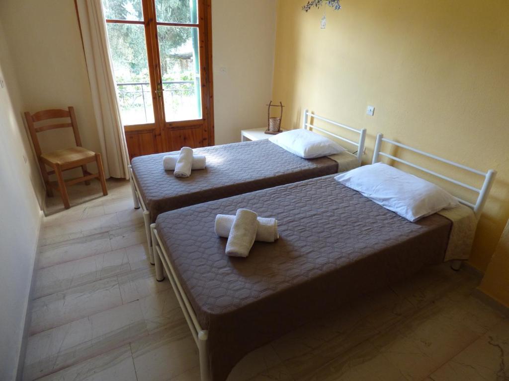 Postel nebo postele na pokoji v ubytování Ipsos Marias Apartments