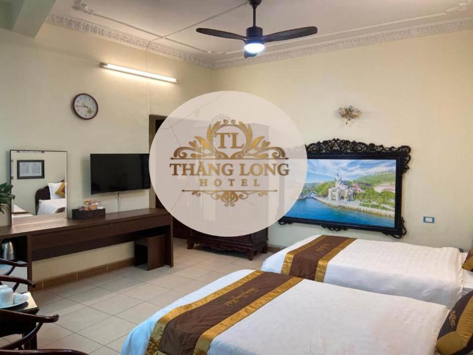 Postel nebo postele na pokoji v ubytování Thang Long Hotel