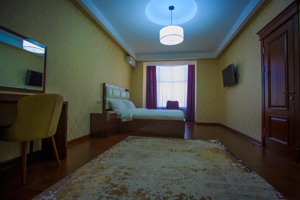 Postel nebo postele na pokoji v ubytování HOTEL AYNI