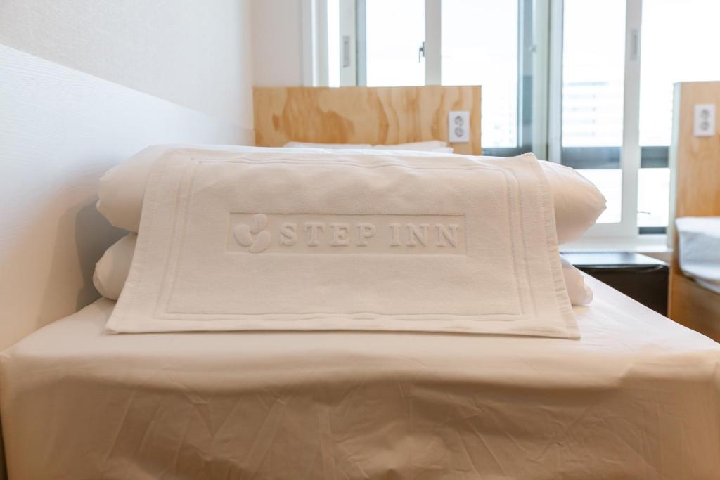 Postel nebo postele na pokoji v ubytování Seoulite Inn Myeongdong Formerly - Step Inn Myeongdong 2