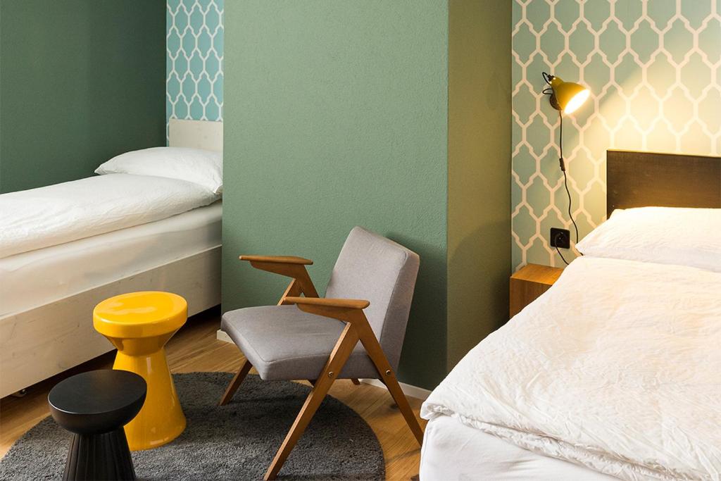 Postel nebo postele na pokoji v ubytování ADLER Boutique Hotel