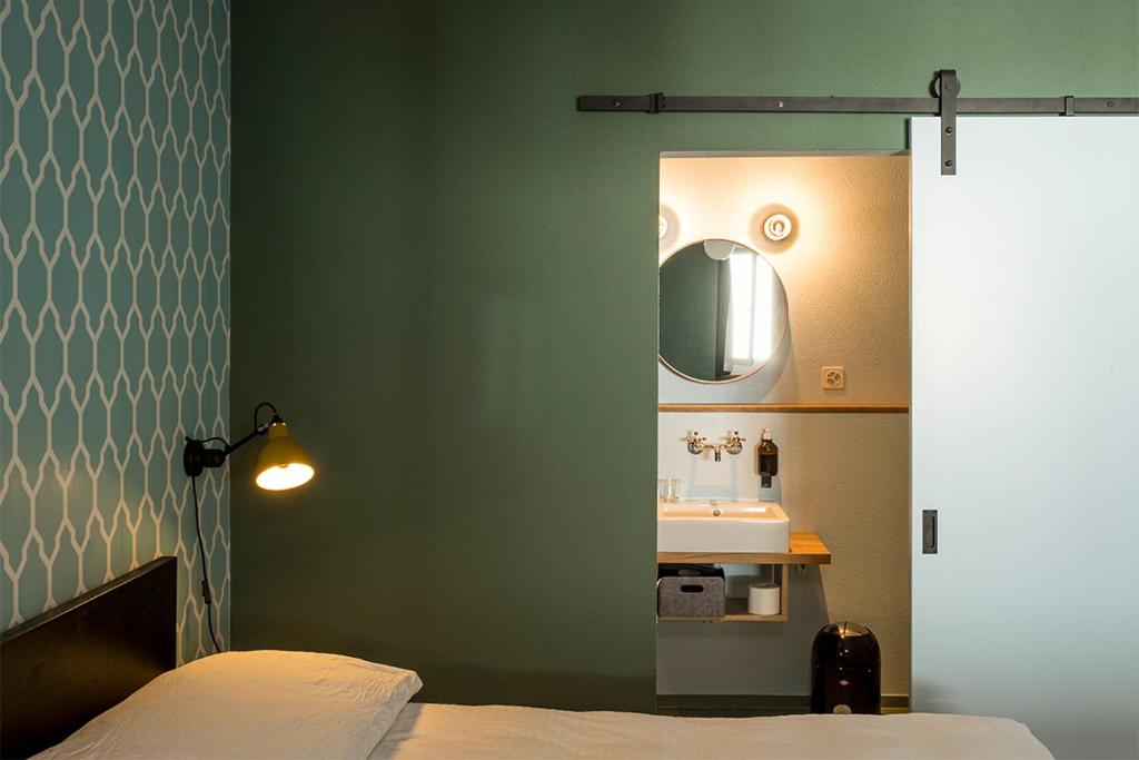 Postel nebo postele na pokoji v ubytování ADLER Boutique Hotel