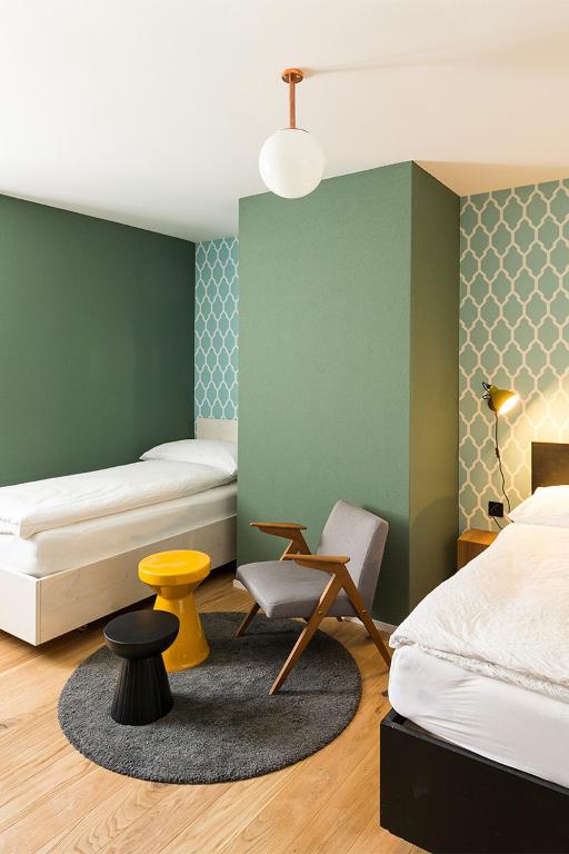 Postel nebo postele na pokoji v ubytování ADLER Boutique Hotel