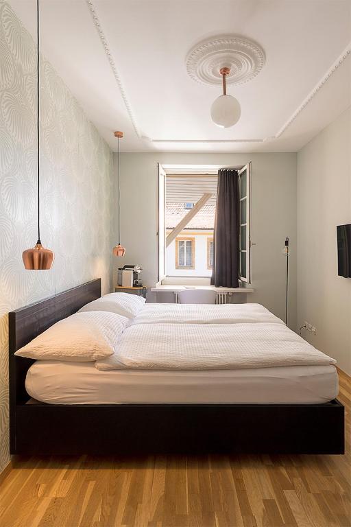Postel nebo postele na pokoji v ubytování ADLER Boutique Hotel