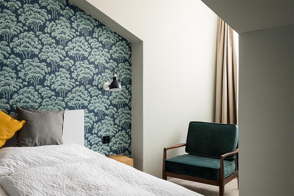 Postel nebo postele na pokoji v ubytování ADLER Boutique Hotel
