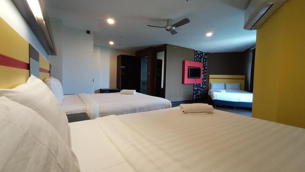 Postel nebo postele na pokoji v ubytování Sense Hotel Taiping